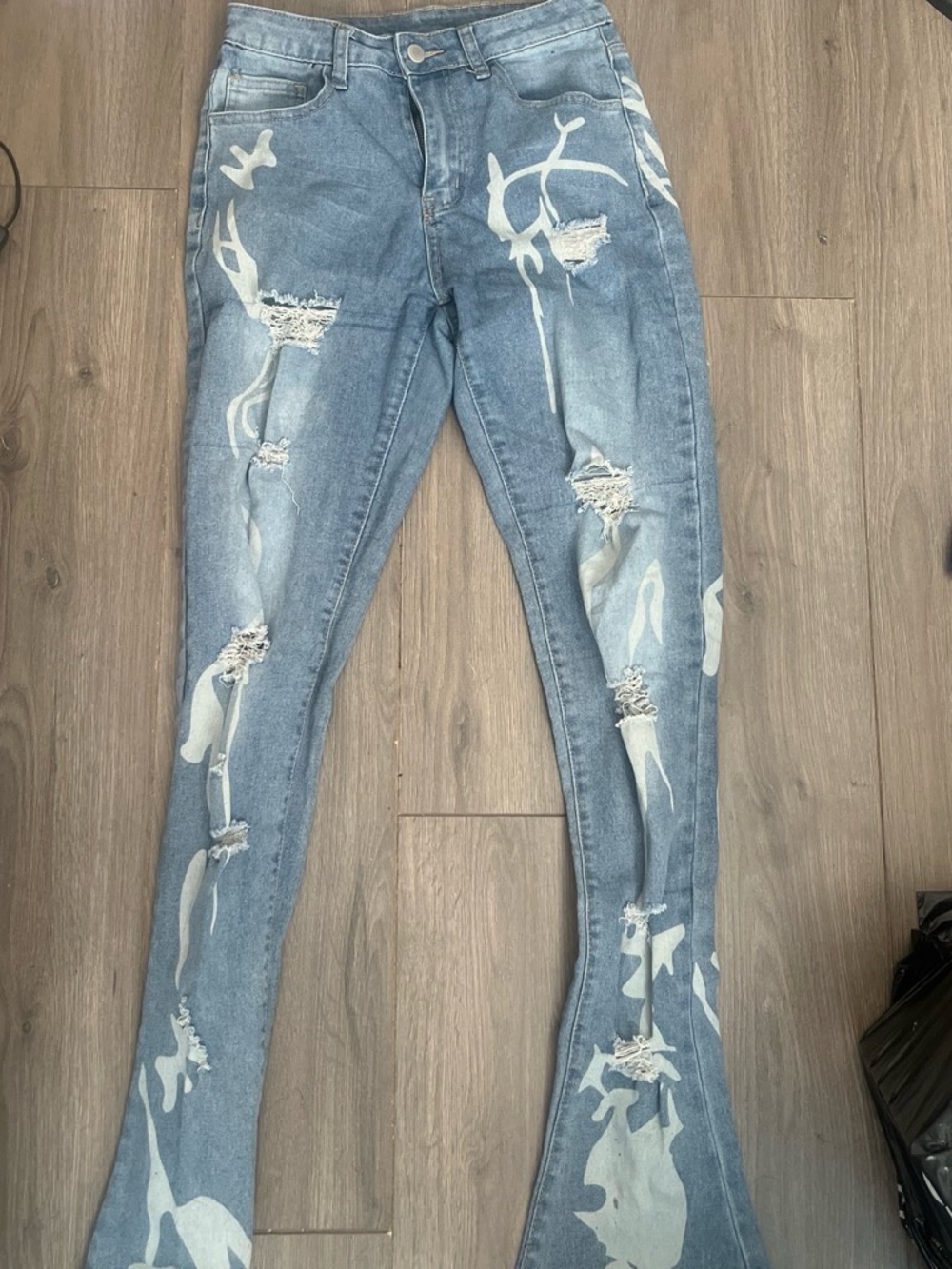 SHEIN Light Blue Distressed Flare Jeans with White Paint-Effect